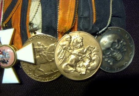 4th class  cross inside of the medal bar of unknown German Freikorps veteran..jpg