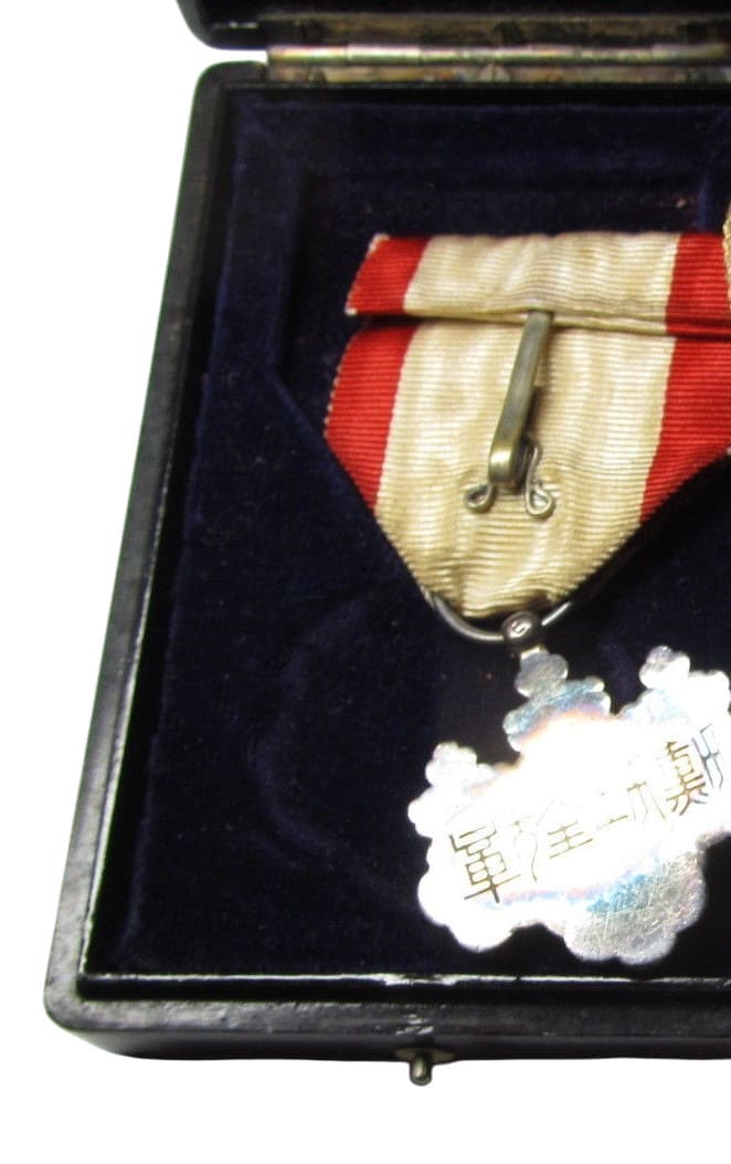 8th class order  of the Rising Sun with mark ヒ cased.jpg