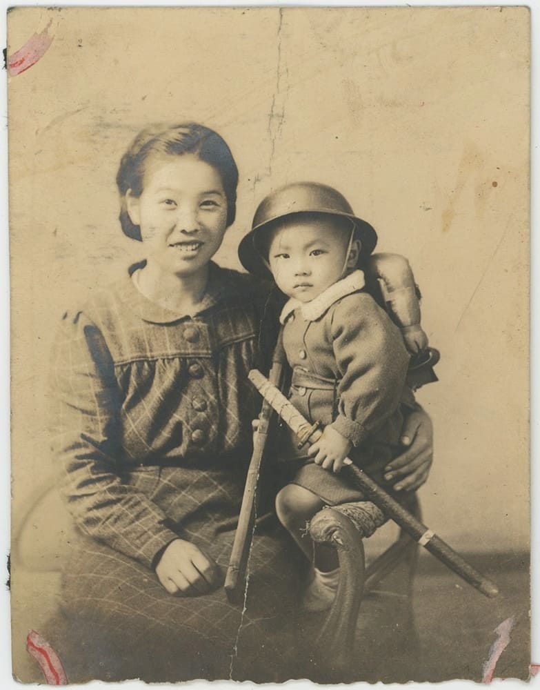 Boy in Military Costume with Mother c.1940.jpeg