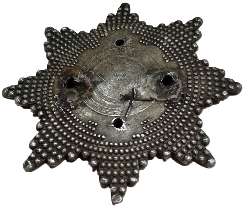Burned and Destroyed Order of the Auspicious Clouds breast star.jpg