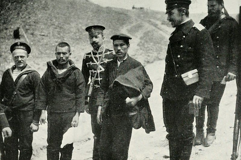 Don Jaime (back, with moustache) with Japanese POWs, 1904.jpg