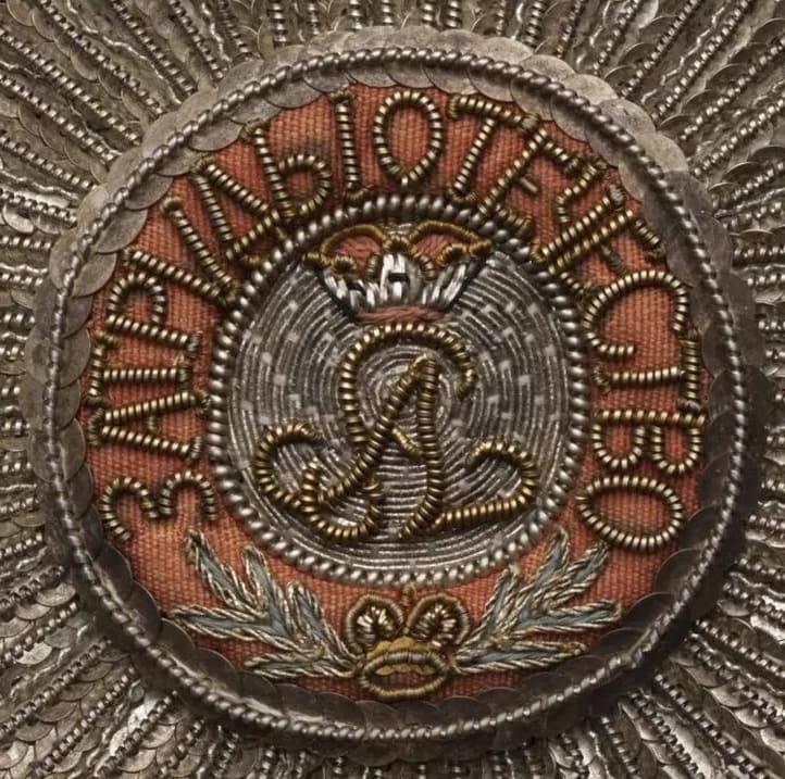 Embroidered breast stars of  Saint Alexander Nevsky order.jpg