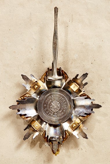 Fake breast star  of order of the Rue Crown combined with the Garter.jpg