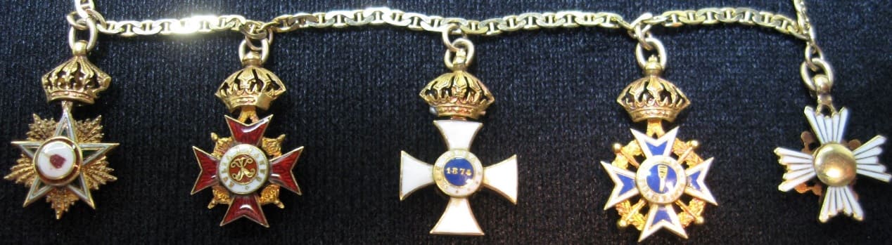 Gold chain of five miniatures that belong to William Henry Cornwell.jpg