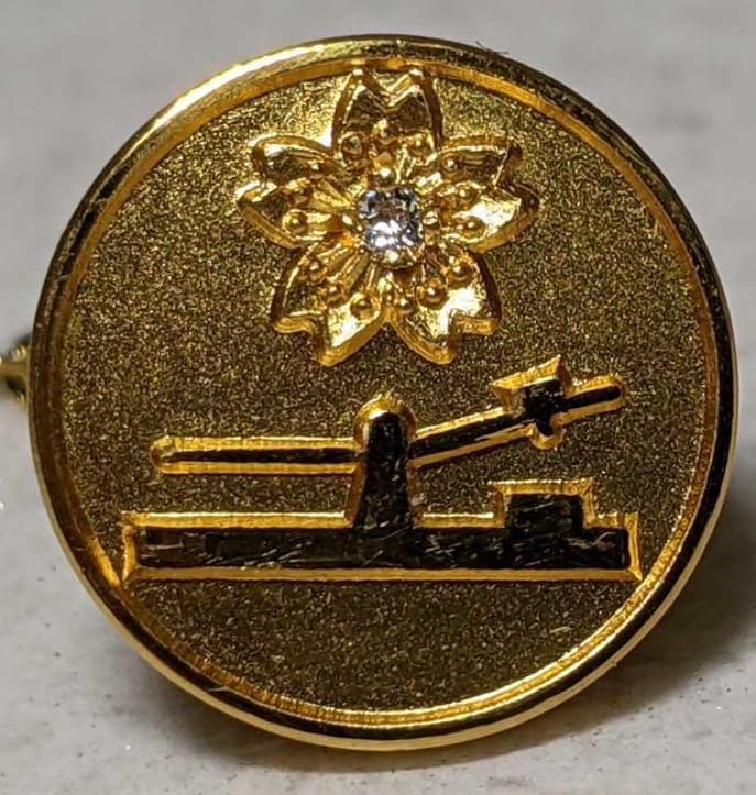 golden lapel pin  with diamond.jpg