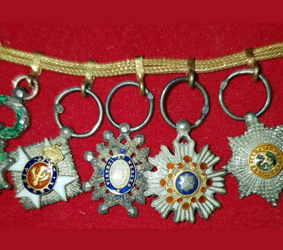 Group of miniature awards with Sacred Treasure order breast star and  Double Dragon.jpg
