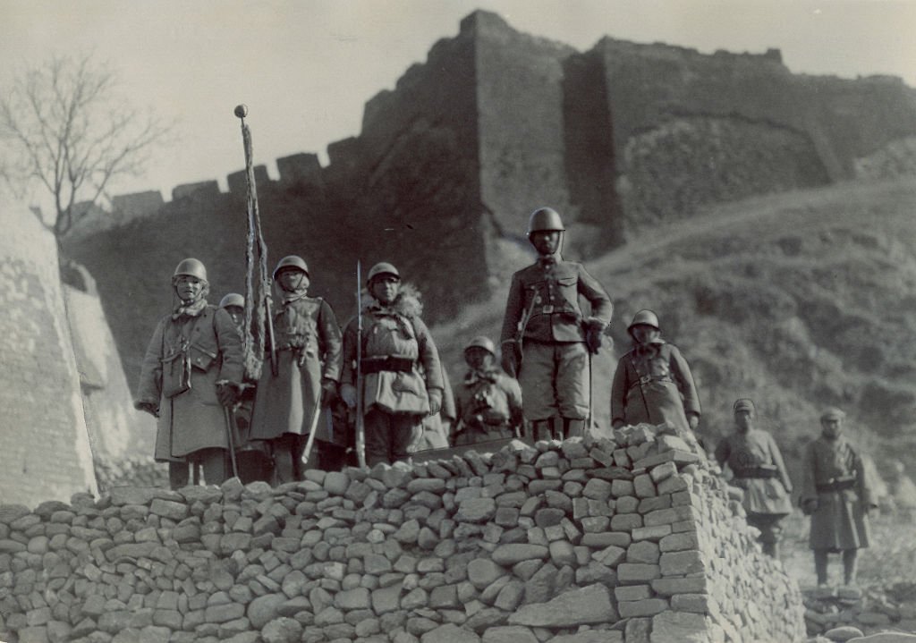 Imperial Japanese Army soldiers enters the Gubeikou Castle as a part of the Battle of Rehe on March 12, 1933 in Gubeikou, China.jpg