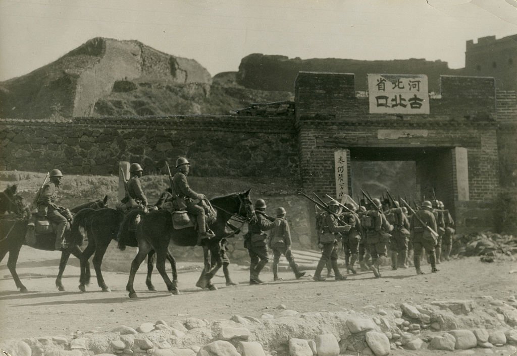 Imperial Japanese Army soldiers enters the Gubeikou Castle as a part of the Battle of Rehe  on March 12, 1933 in Gubeikou, China.jpg