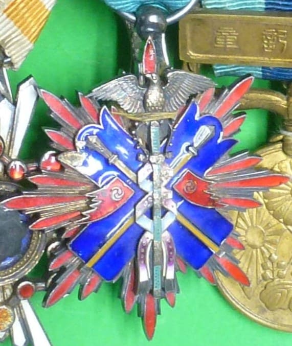 Japanese medal bar with golden  Kite order.jpg