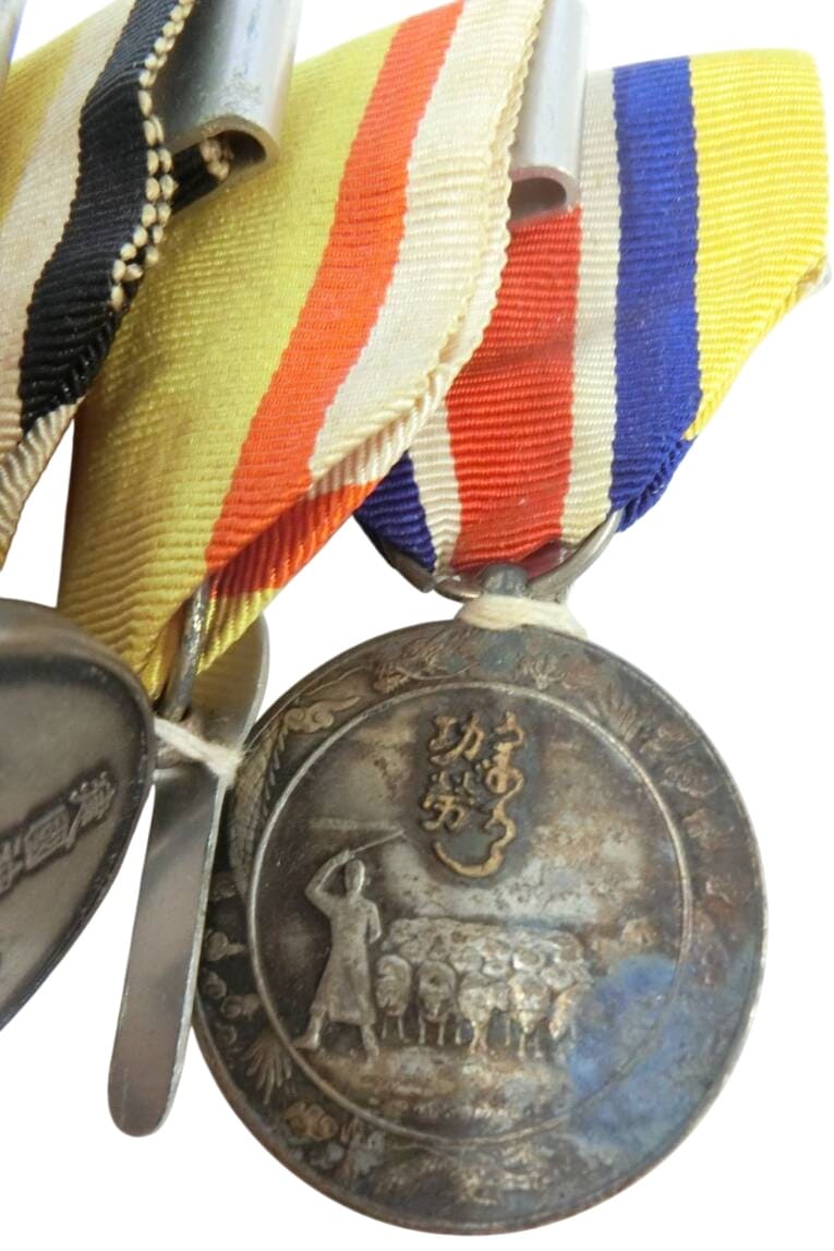 Japanese  Medal Bar with Manchukuo Order and Inner  Mongolia Medal.jpg