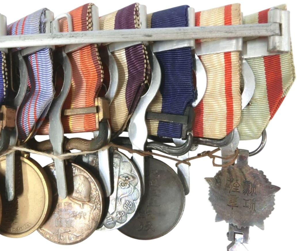 Japanese Medal Bar with Manchukuo Order and Inner Mongolia Medal.jpg