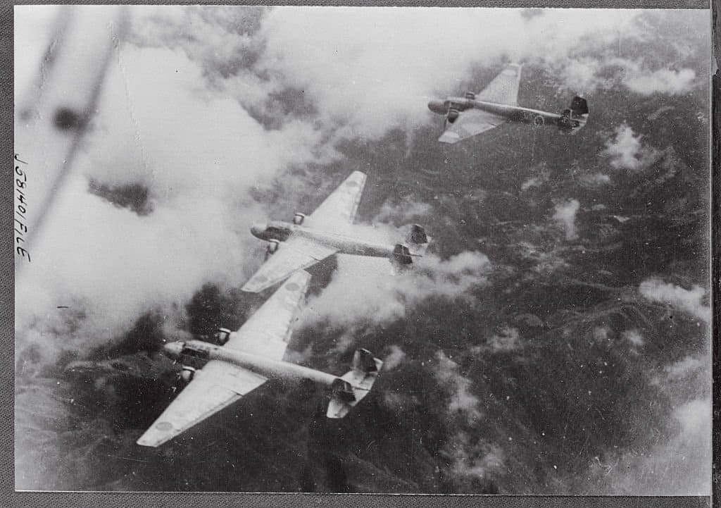 Japanese Navy warplanes barrel through the air over the Chinese provision capital, Chungking.jpg