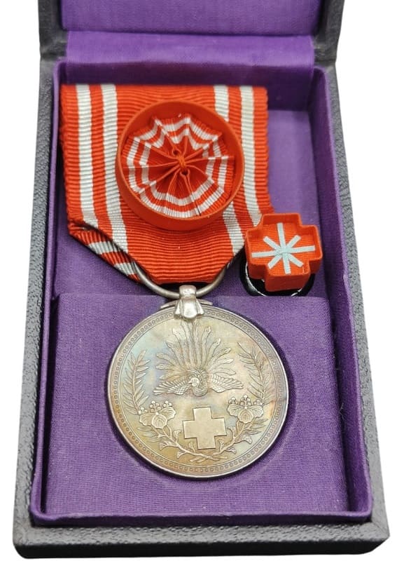 Japanese Red  Cross Medal in Wartime Cardboard Case.jpg