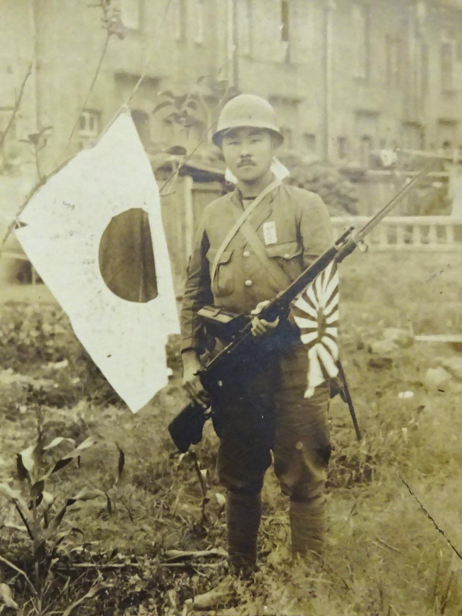 Japanese soldier with flag.jpg