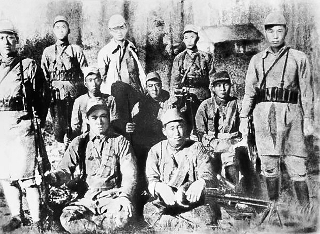 Kim Il Sung among guerrilla fighters.jpg