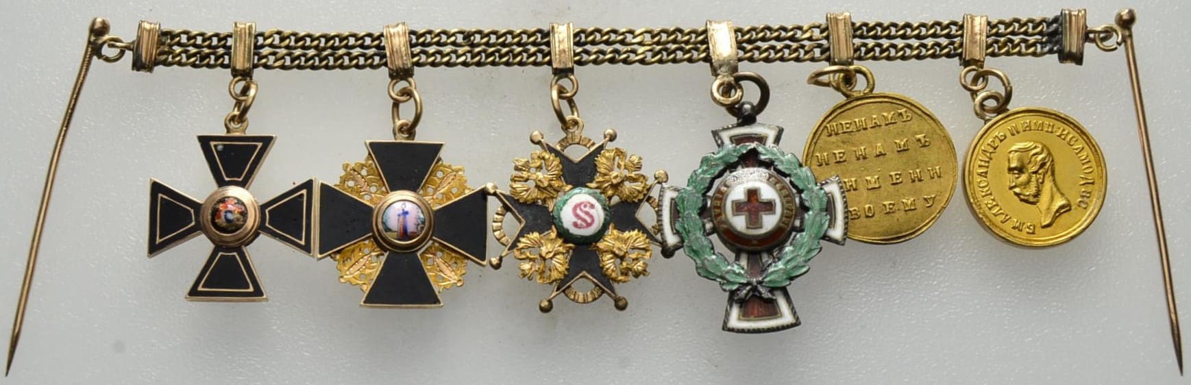 Miniature chain with six miniatures of awards.jpg