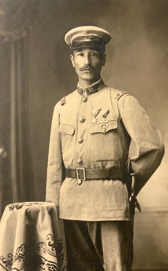 Private first class with 7th class order of Eight Trigrams.jpg