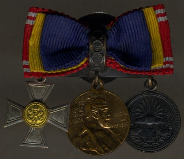 Prussian miniature bow with  Japanese Red Cross Society medal.jpg