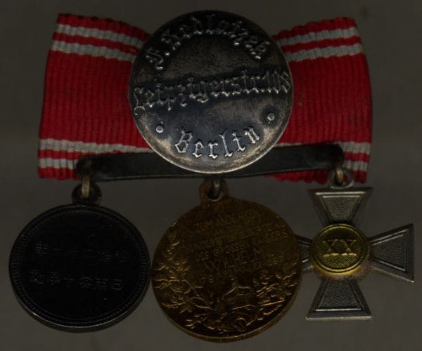 Prussian miniature bow with Japanese Red Cross Society medal.jpg