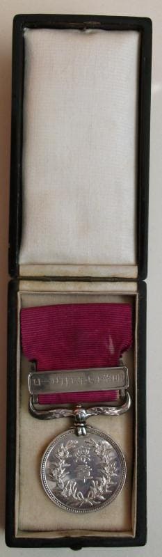 Red Ribbon_Medal of Honour No.10 awarded in 1884.jpg