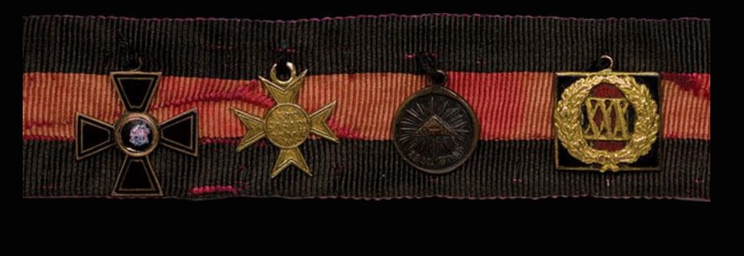 Ribbon with four tailcoat awards.jpg Ribbon with four tailcoat awards.jpg