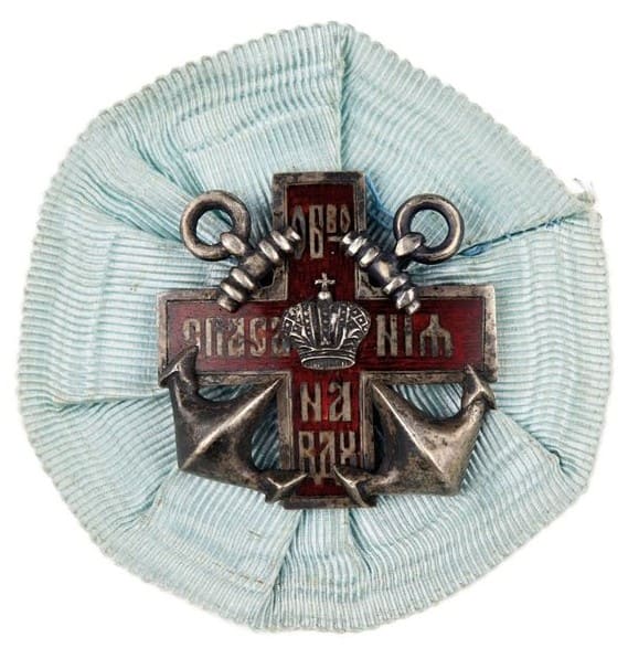 Silver badge with original rosette.jpg