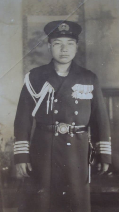 Son of a Navy Captain with his father's awards.jpg