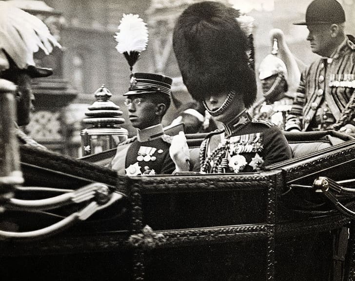 The Prince of Wales, Edward VIII, rides in an open carriage with the Prince Hirohito.jpg