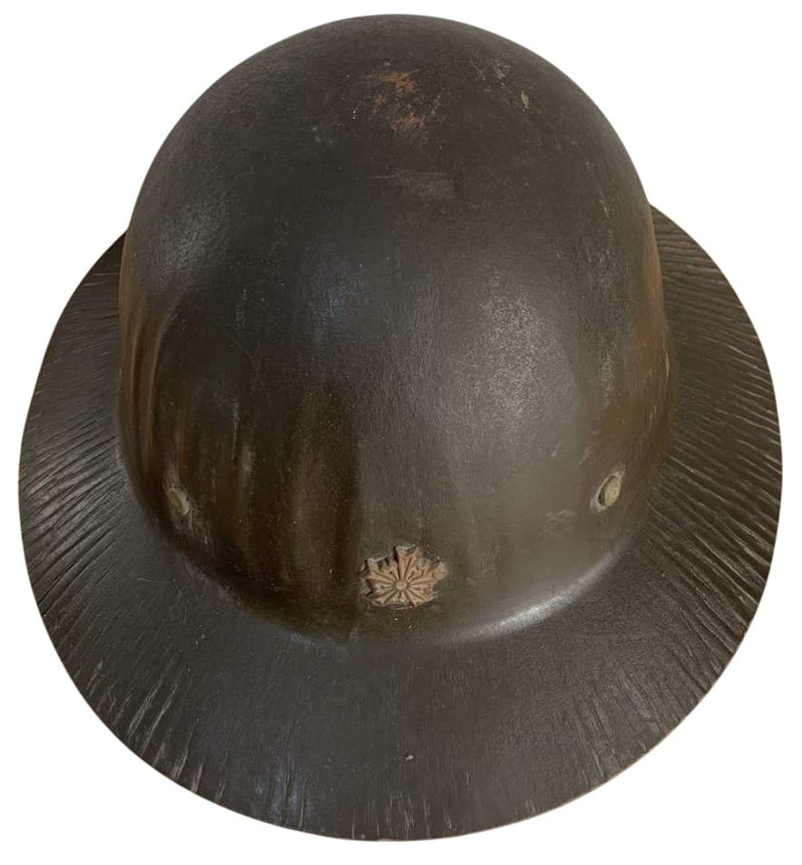 Wooden helmet  with large cap badge.jpg