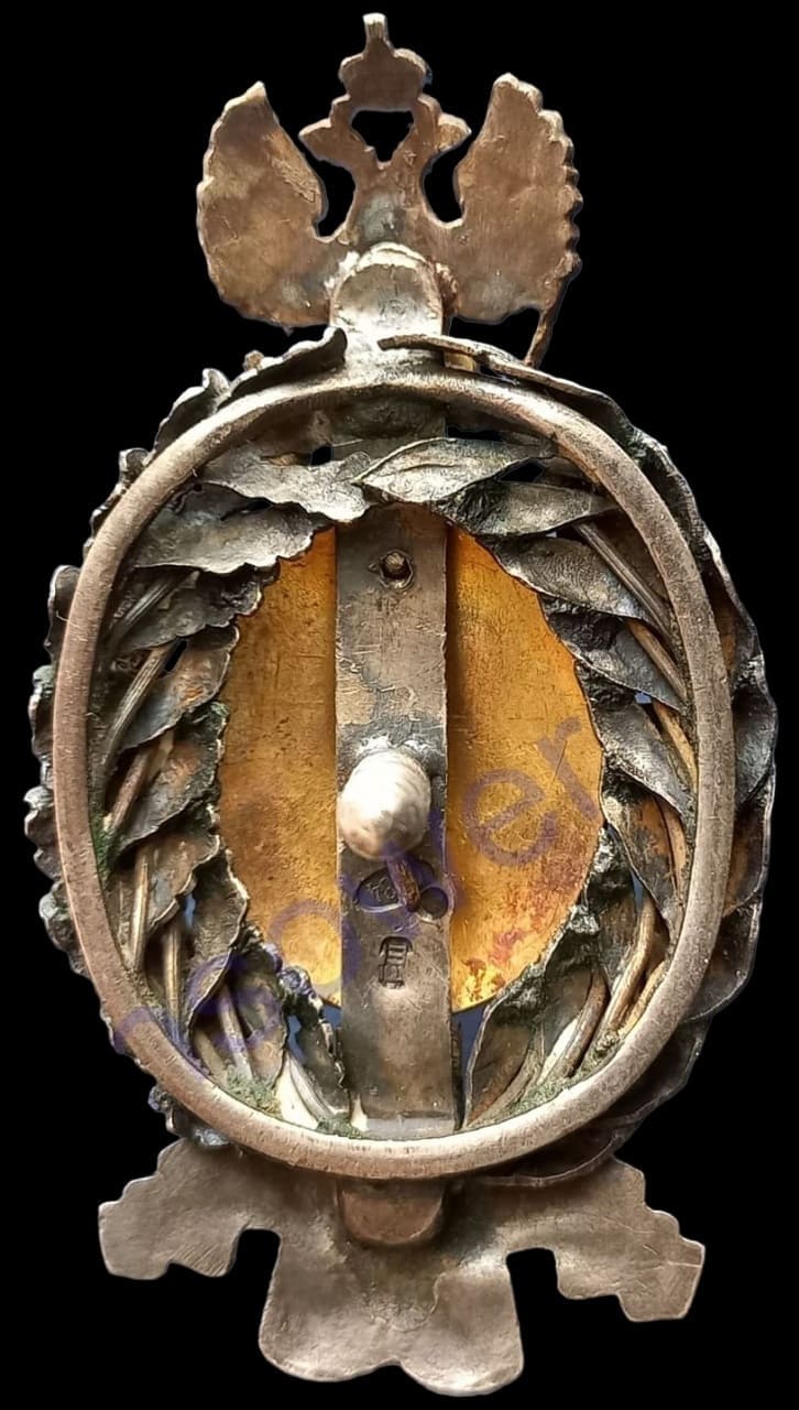 Знак «В память 50-летия  земских учреждений» клеймо ЕШ.jpg